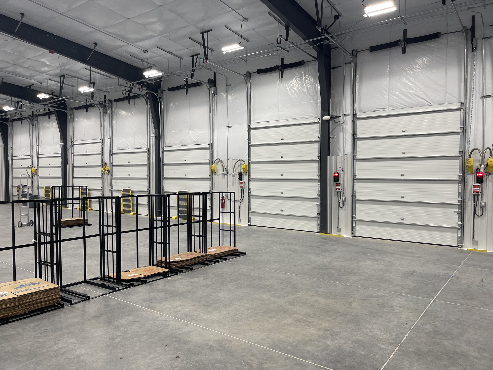 Aerial view of a commercial warehouse, truck court, access roads and parking